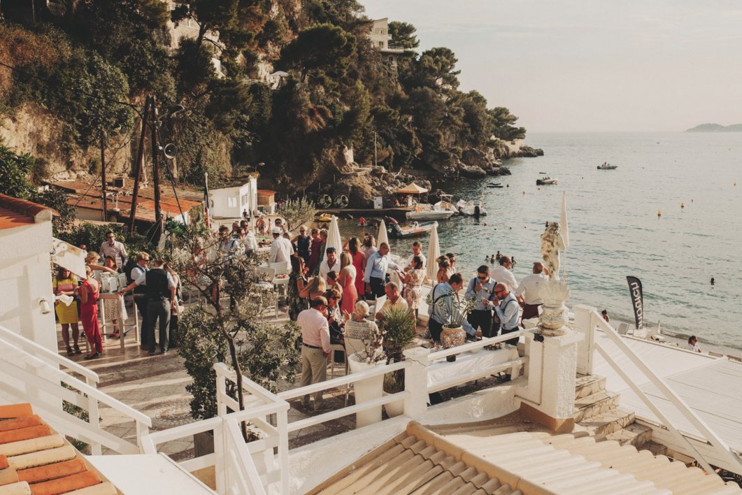 Wedding guests on a terrace above the bay of Villefranche-sur-Mer, Côte d’Azur, France